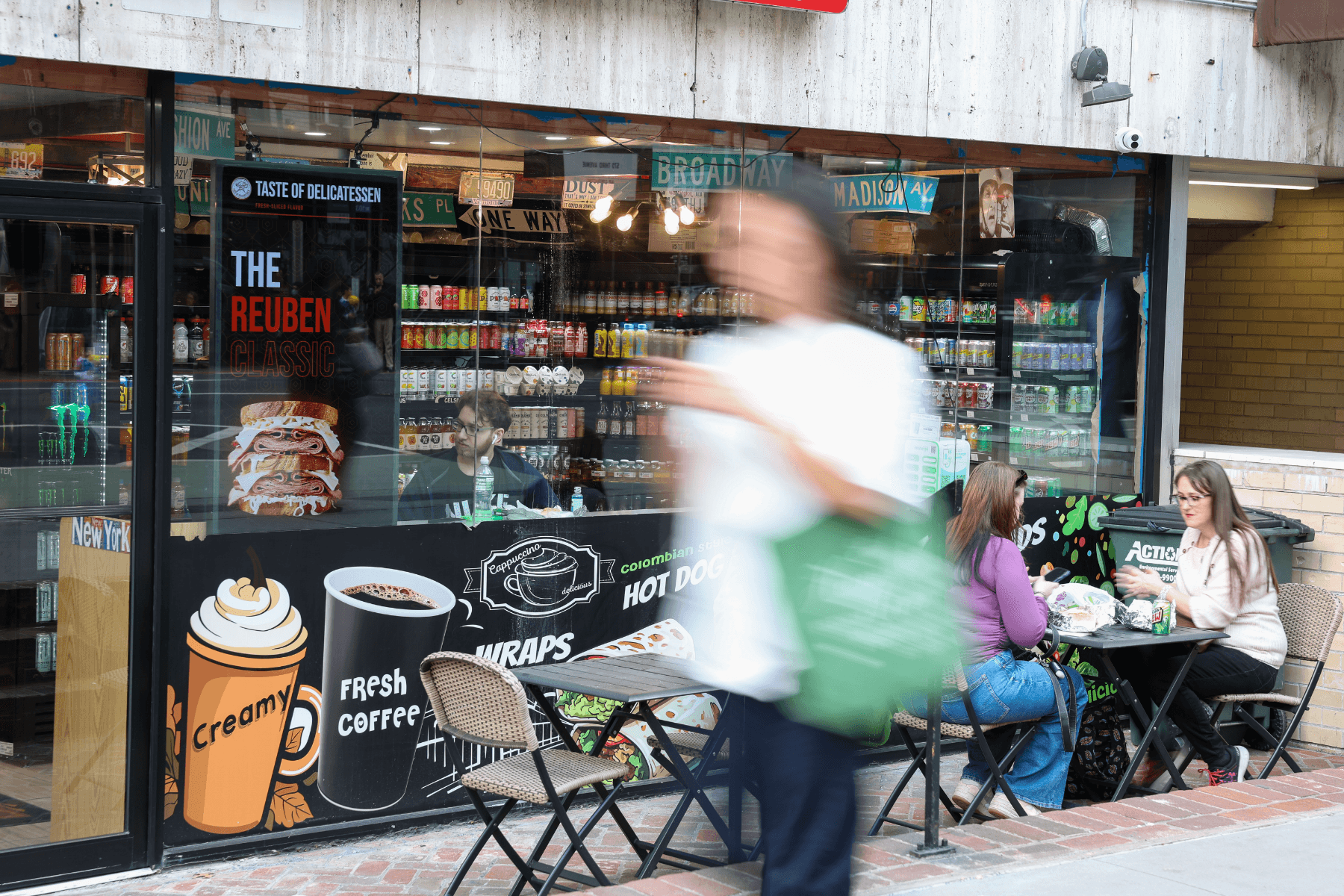 Taste of Deli storefront with a PrimeSight screen